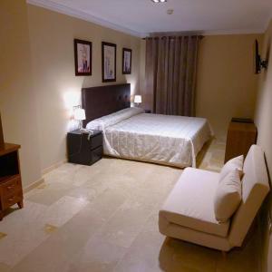 Postel nebo postele na pokoji v ubytování Hotel Sol Sanlúcar