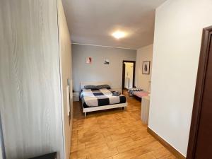 a bedroom with a bed and a hallway at Vatican Flat Cozy with Terrace in Rome