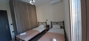 Katil atau katil-katil dalam bilik di AYRA ROOMS ALIVERI
