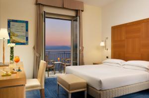 Posteľ alebo postele v izbe v ubytovaní Hotel Raito Wellness & SPA