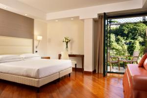 Posteľ alebo postele v izbe v ubytovaní Hotel Raito Wellness & SPA
