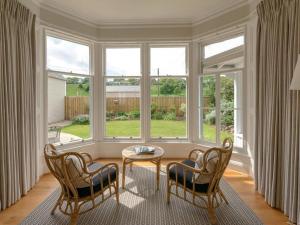 a living room with a table and two chairs at The Latch in North Berwick