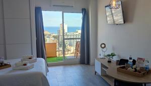 Posteľ alebo postele v izbe v ubytovaní NORDIC SUITE Apartamentos Minerva NEW APARTMENT Vistas al Mar