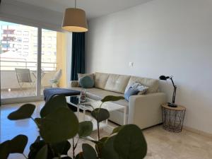 A seating area at Malagadevacaciones - La Marea
