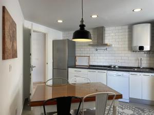 A kitchen or kitchenette at Malagadevacaciones - La Marea