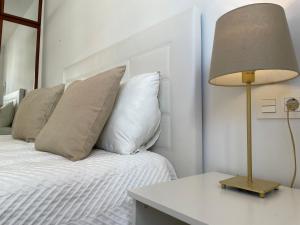 A bed or beds in a room at Malagadevacaciones - La Marea