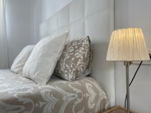 A bed or beds in a room at Malagadevacaciones - La Marea