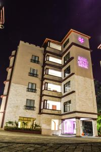 a building with a sign on the side of it at Decale Jewel Stone Hotel in Nairobi