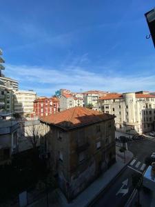 an old building in the middle of a city at Santander Jiménez Díaz 7B in Santander