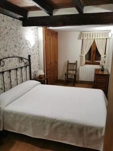 A bed or beds in a room at CASA DE LOS ABUELOS