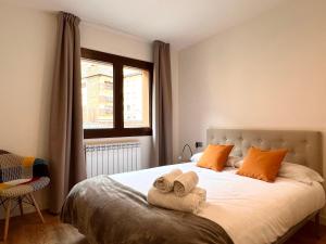 Postel nebo postele na pokoji v ubytování Espot Cowork & Apartments - L'Amfitriona