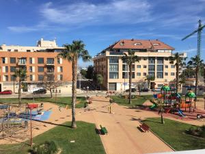 a park with a playground with a slide at Modern & sunny apartment near Valencia in Paiporta