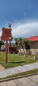 a sign for a pineapple store in front of a building at Leme Plaza Hotel in Leme