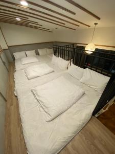 Postel nebo postele na pokoji v ubytování 逢甲漫漫