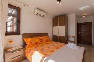 Postel nebo postele na pokoji v ubytování Guesthouse Santin