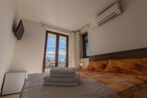 Postel nebo postele na pokoji v ubytování Guesthouse Santin