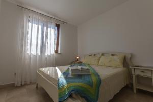 Postel nebo postele na pokoji v ubytování Guesthouse Santin