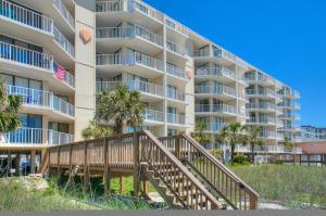 a stairway leading to a large apartment building at Serenity By The Sea I Crescent Sands I Windy Hill I North Myrtle Beach in Myrtle Beach