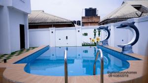 a swimming pool on the roof of a building at Gillant Luxury Homes in Benin City