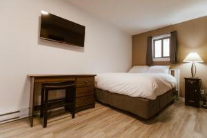 Postel nebo postele na pokoji v ubytování Lone Star Motel