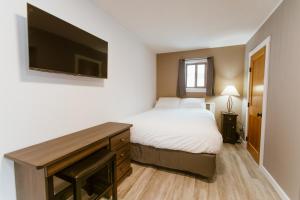 Postel nebo postele na pokoji v ubytování Lone Star Motel
