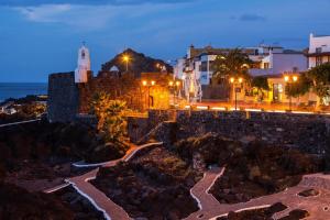 a view of a city at night with lights at Bella Home in Garachico