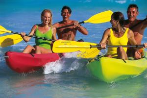 a group of people in kayaks in the water at Riu Palace Mexico - All Inclusive in Playa del Carmen