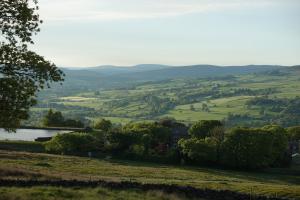 a view of the hills from a hillside at Silver Well Cottage in Ilkley