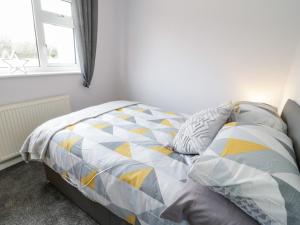 Postel nebo postele na pokoji v ubytování 17 Ffordd Gwenllian