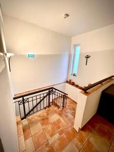 an empty room with a staircase and a window at Hotel zur Römerbrücke in Neuwied