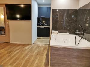 Ванная комната в Appart Hotel Spa Perpignan