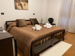 two stuffed animals sitting on a bed in a room at Villa Marogna in Alghero