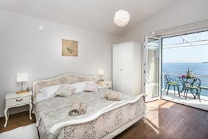 Posteľ alebo postele v izbe v ubytovaní Apartments Villa Mirjana