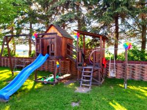a play set with a slide and a playground at Landhaus Levitzow in Levitzow