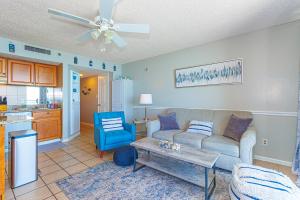 a living room with a couch and a table at Oceanfront 1 bedroom King suite- Ocean Forest Plaza 1911 in Myrtle Beach