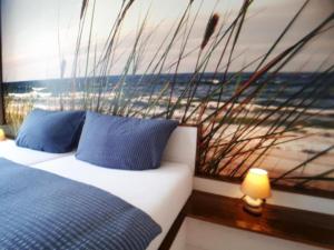 Ein Bett oder Betten in einem Zimmer der Unterkunft Strandfeeling