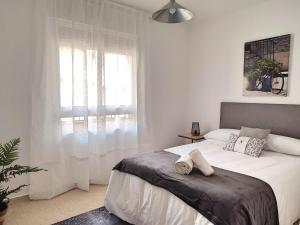 Postel nebo postele na pokoji v ubytování Céntrico Apartamento Jardines de Vallellano