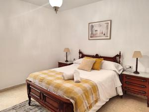 Postel nebo postele na pokoji v ubytování Céntrico Apartamento Jardines de Vallellano