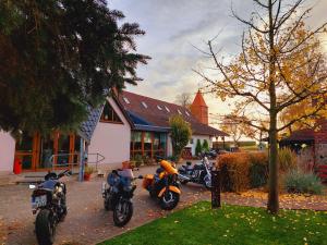 a group of motorcycles parked in front of a building at Landhaus Levitzow in Levitzow