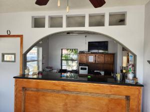 an archway in a room with a counter top at Relax inn in Frostproof