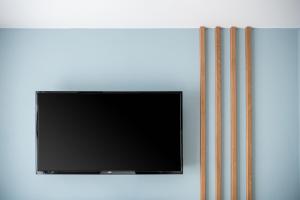 TV a/nebo společenská místnost v ubytování M City Hotel