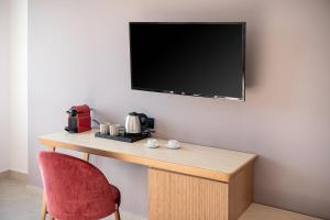 TV a/nebo společenská místnost v ubytování M City Hotel