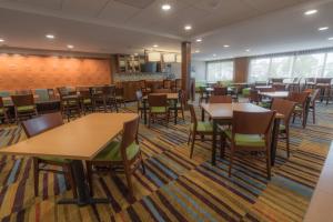 a dining room with wooden tables and chairs at Fairfield Inn & Suites by Marriott Gaylord in Gaylord
