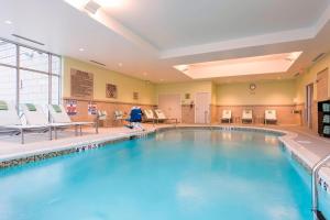 a large swimming pool in a hotel room at SpringHill Suites by Marriott Chicago Southeast/Munster, IN in Munster