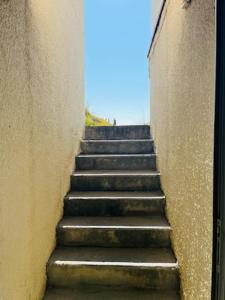 a stairway leading up to a building at Perle rare acces direct a la plage in Mauguio
