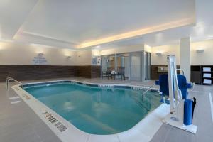 a large swimming pool in a hotel room at Fairfield by Marriott Inn & Suites Denver Airport at Gateway Park in Denver