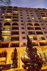 a large building with christmas trees in front of it at Marriott Executive Apartments Sao Paulo in Sao Paulo