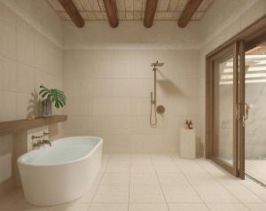 a white bathroom with a tub and a shower at The St. Regis Punta Mita Resort in Punta Mita