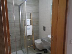 a bathroom with a toilet and a sink at AL-Odeceixe Verde in Odeceixe