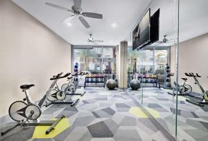 a gym with bikes and a flat screen tv at NEW! Modern & Spacious 1Br/1Bth in Central ATX! Close To Austin Hotspots! in Austin